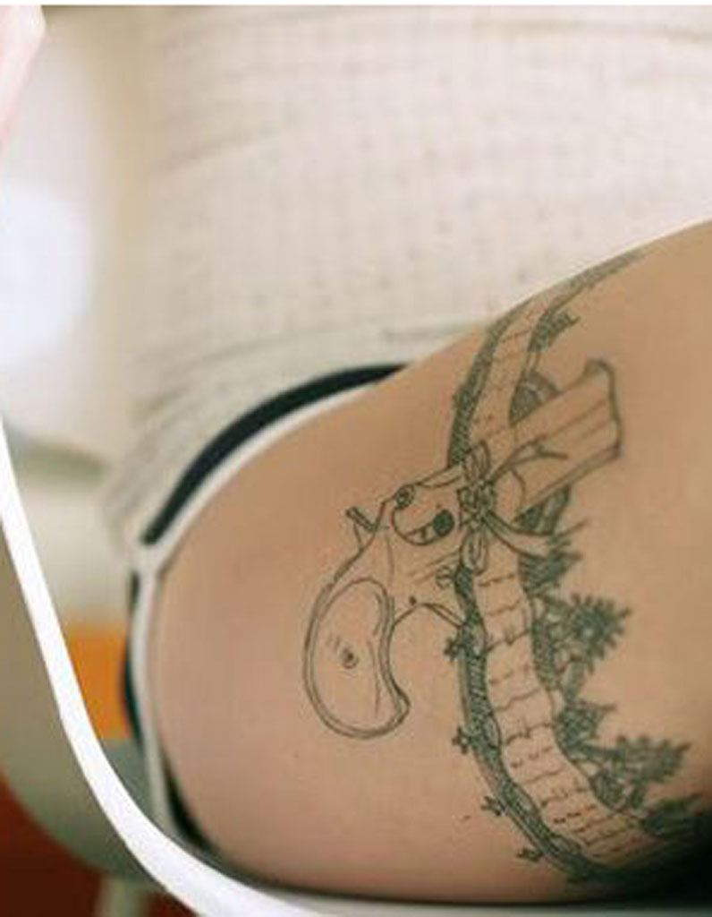 Tatouage cuisse femme